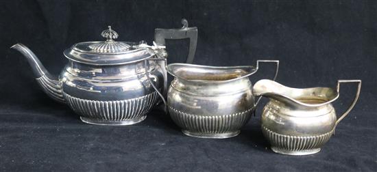 An Edwardian demi fluted silver three piece bachelors tea set, Richard Richardson, Sheffield, 1904/5/6, gross 18.5 oz.
